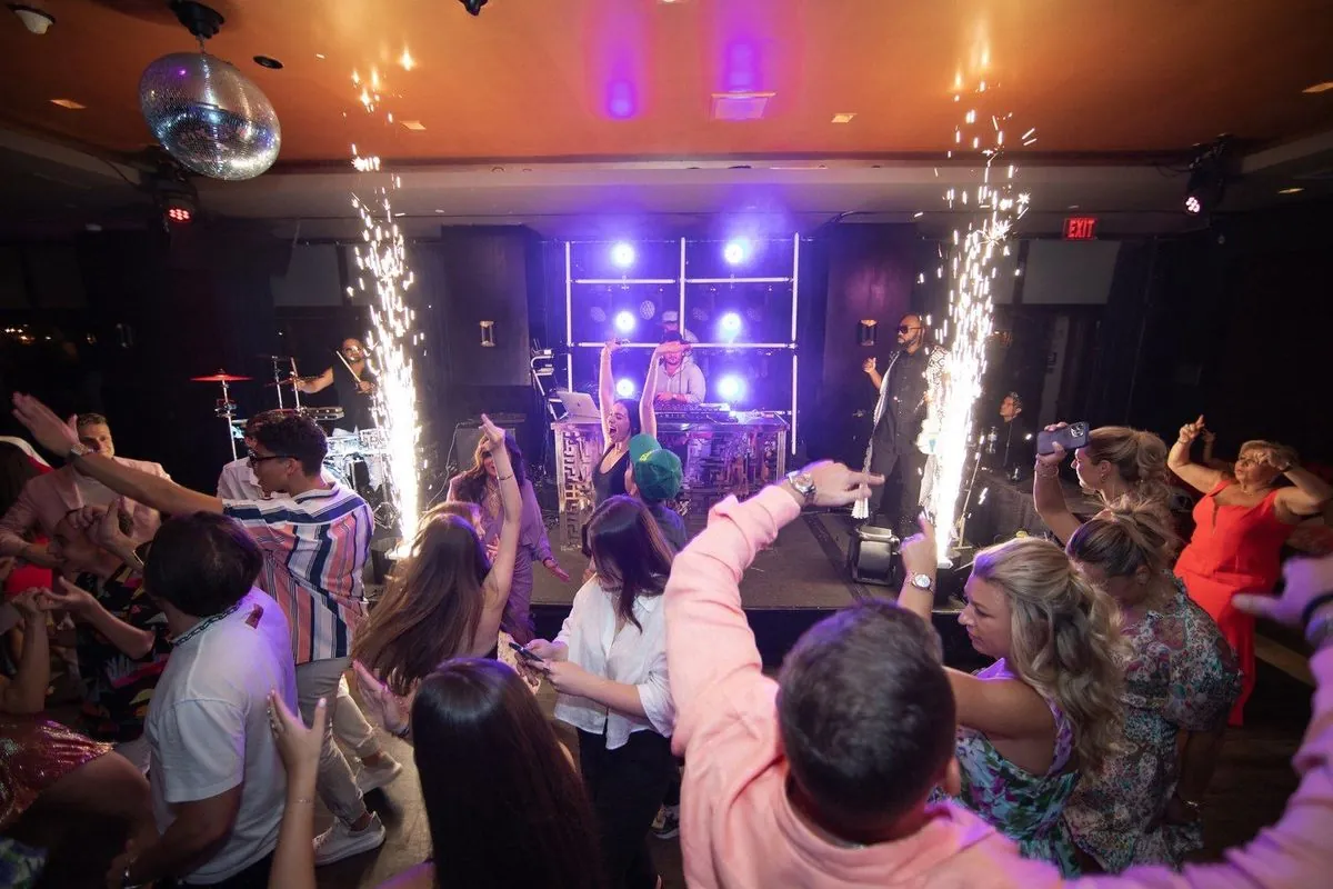 Packed dance floor with cold spark fountains